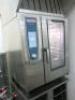 Rational Self Cooking Centre Combi Gas 10 Grid Oven, Model SCC WE 101, 18.6 KW, S/N E11SI16092546977, with Rational Ultra Vent Condensation Hood, Model 60.72.320, S/N ETIUE1605015857 & Comes with Rational Bakery Stand. Size H104 x W85 x D78cm. - 5