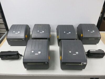 6 x Zebra Desk Top Thermal Label Printer, Model ZD220. Comes with 2 Power Supplies.