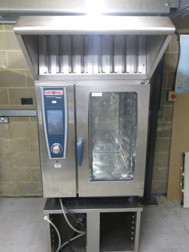 Rational Self Cooking Centre 5 Senses, Model 01, 10 Grid, 3 Phase Electric. Comes with Rational Condensation Hood, Model 60.72.320, S/N ET1UE16015012922 & Rational Stainless Steel Stand, Model 60.30.328. Size on Stand with Hood H210 x W85 x D80cm