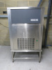 Maidaid Ice Maker, Model M155-65A, S/N2016020768928, DOM 2016. Comes with Stainless Steel Stand & 2 x Polycarbonate Scoops. Size H147 x W84 x D74cm.