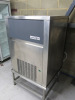 Maidaid Ice Maker, Model M155-65A, S/N2016020768928, DOM 2016. Comes with Stainless Steel Stand & 2 x Polycarbonate Scoops. Size H147 x W84 x D74cm. - 2