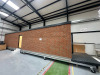 15.3m x 2.62m - Ex-Show Room Modular Housing Display Unit with Brick Front Finish, 2 Rendered Ends with Finish Required Top & Rear. Unit Sits on 2 x Sets of 6 Wheeled Galvanised Mobile Frames (7 x 3m). Fitted with Kitchen, Toilet, Shower room & Bedroom, A - 6