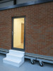 15.3m x 2.62m - Ex-Show Room Modular Housing Display Unit with Brick Front Finish, 2 Rendered Ends with Finish Required Top & Rear. Unit Sits on 2 x Sets of 6 Wheeled Galvanised Mobile Frames (7 x 3m). Fitted with Kitchen, Toilet, Shower room & Bedroom, A - 10