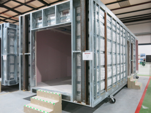 9.3m x 3.3m - Galvanised Steel Carcass, Part Finished Modular Building. Unit Comprises of 3 Rooms, Open Ended Porch Area, Middle Room with Entrance Doorway and Room with Entrance Doorway & Large Opening to End. Overall Size H3m x 9.3m x 3.3m. NOTE: adapta