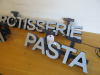 3 x LED Lit signs to Include: 1 x Double Sided Led Lit Deli Sign on Blue Metal Box Frame with 2 x LED Drivers. Size H11 x W31 x D15cm. 1 x Led Lit Pasta Sign with LED Driver, Size H11 x W47 x D6cm & 1 x Led Lit Rotisserie Sign, Size H11 x W86 X D10cm ( - 2