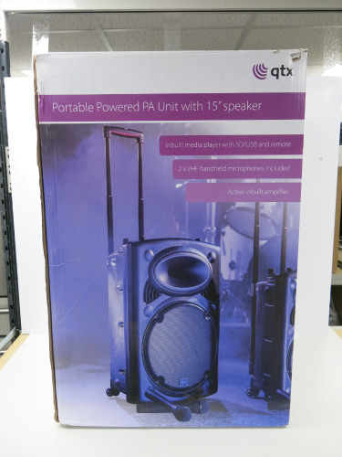 Boxed QTX Portable Powered PA Unit with 15" Speaker, Model QR15PA. Comes with 1 x VHF Wireless Microphones & IR Remote.