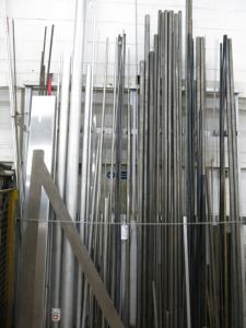 Rack Containing Approx 65 Lengths of Bar Stock including Stainless Steel, Mild Steel & Aluminium (Next to Rhodes Pierce-All).