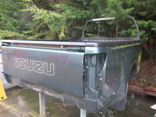 Rear Pick-Up Body of Isuzu Truck in Dark Green with Liner.