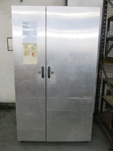 2 Door Metal Cabinet with Shelves & Power, Size H216 x W122 x D68cm. NOTE: locks have been drilled.