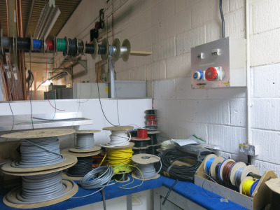 Quantity of Assorted Rolls/Reels of Wire, Electrical Fittings, Nuts, Bolts & Other (As Viewed). LOCATED IN FRONT PLUMBING WORKSHOP SHED 1.