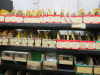 4 x Bays of Approx 50 Shelves with Large Stock of Electrical Wiring Accessories to Include: Cable Markers, Earthing/Conductor Fixings, Conduit Brackets, Terminal Blocks, Brass & Other Conduit Fittings & More (As Viewed). LOCATED IN STORES PASSAGE AT REAR - 5