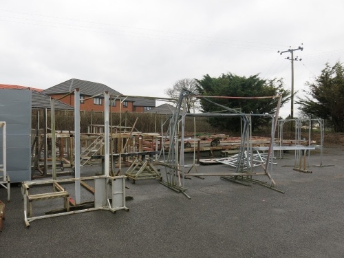 Large Quantity of Scrap Metal to Left of Yard to Include: Large Dolly's, RSJ's, Box Metal, Workshop Table Frames, Stillages, Fixed Steps, Barrier & Other (As Viewed).