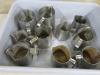 10 x Assorted Sized Stainless Steel Jugs.