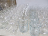 Approx 242 x Assorted Branded G & Co, Artner & Other Restaurant & Bar Glasses to Include: 33 x Champagne, 72 x Wine Glasses, 5 x Brandy, 7 x Cocktail, 100 x Water Glasses, 6 x Water Bottles, 6 x Milk Bottles & 3 x Wine Carafes. - 16