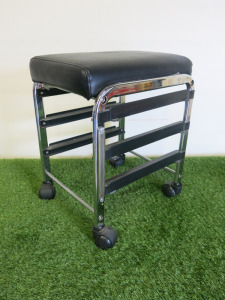 Black Faux Leather Stool on Castors with Space for 3 Plastic Trays.