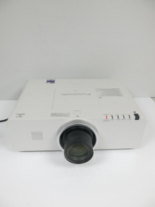 Panasonic LCD Projector, Model PT EZ570E WUXGA with LNS-S20 Standard Zoom Lens. Lamp Running Hours 2594. Comes with Remote & Power Supply.