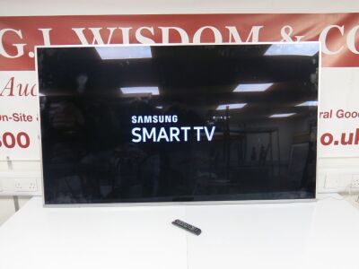 Samsung 75" 4K Ultra HD TV, Model UE75MU7000TXXU, S/N 0AU63SLJC00034T. Comes with Remote Control & Part Wall Bracket.