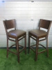 Pair of Dark Walnut Stalls Upholstered in Brown Faux Leather, Size H110cm.