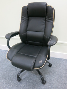 Executive Faux Leather Chair (As Viewed/Pictured).