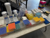 Large Quantity of Testing Vials & Other to Include: 19 x Cryo Storage Box Holding 81 Vials, 4 x Twist Food Containers, 5 x Bags of Vials & Other (As Viewed).