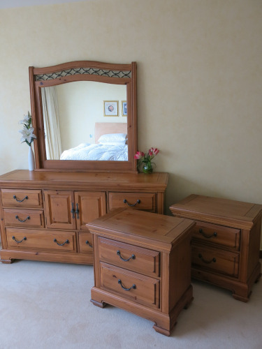 Broyhill Country Style Stained Pine Wooden Bedroom Furniture to Include: 6 Draw, 2 Door Chest of Draws with Fixed Over Mirror (Size H90 x W173 x D48cm) & Pair of Matching 2 Draw Bedside Tables with Additional Hidden Draw to Base. (Made in USA).