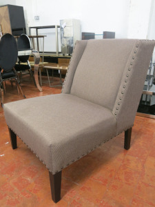 Eichholtz Chair Columbia, Designer Lounge Chair in Brown Fabric with Stud Detail.