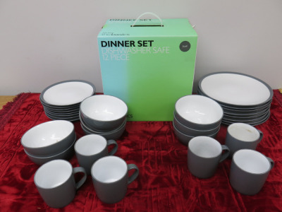 Large Quantity of John Lewis China Dinner Set in Steel to Include: 12 Piece Boxed Set, 7 x Plates, 7 x Side Plates, 8 x Bowls & 7 x Mugs (As Viewed).