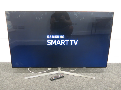 Samsung 55” TV, Model UE5MU8000T. Comes with remote.