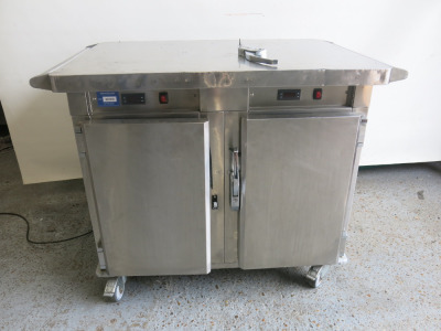 Williams 2 Door Mobile Stainless Steel Refrigerator, Model HE2U-J with well space at rear for serve trays (missing brackets to Lid). A/F Sold for Spares or Repair.