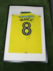 Norwich City FC, Signed Home Shirt 'Mario Vrancic' 2017/2018 Season (No Certificate of Authenticity). Comes in Frame Size 94 x 64cm, Mounted with Perspex.