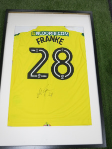 Norwich City FC, Signed Home Shirt 'Marcel Franke' 2017/2018 Season (No Certificate of Authenticity). Comes in Frame Size 94 x 64cm, Mounted with Perspex.