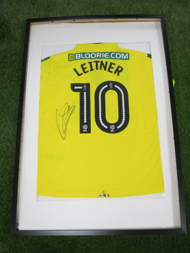 Norwich City FC, Signed Home Shirt 'Moritz Leitner' 2017/2018 Season (No Certificate of Authenticity). Comes in Frame Size 94 x 64cm, Mounted with Perspex, Requires Repair.