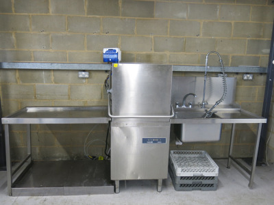 Maid Aid Pass Through Dish Washer, Model C1035WS, S/N 4362993, DOM 09/2020. Size H145 x W70 x D80cm. Comes with Stainless Sink with Swan Neck Taps & Pre Rinse, Size W110cm, 5 Trays & Stainless Steel Out Table, Size W110cm.