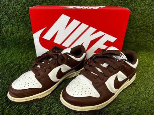 Pair of Nike Dunk Low in Sail/Cacao Wow-Coconut Milk, Size 3. Comes in Box. NOTE: hardly worn in very good condition.