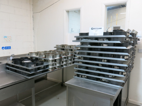 Approx 600 Assorted Used Cake Tins in Various Sizes with 3 x 18 Rack Trolley's Included.