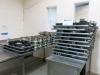 Approx 600 Assorted Used Cake Tins in Various Sizes with 3 x 18 Rack Trolley's Included.