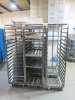6 x Stainless Steel Mobile Oven Racks to Include: 4 x 16 Shelf, 1 x 20 & 1 x 10 Shelf with 60 x Trays.