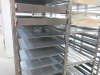 6 x Stainless Steel Mobile Oven Racks to Include: 4 x 16 Shelf, 1 x 20 & 1 x 10 Shelf with 60 x Trays. - 4