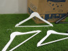 43 x Clothes Hangers to Include: 19 x Black Wood, 17 x White Wood & 7 Plastic Others. - 2