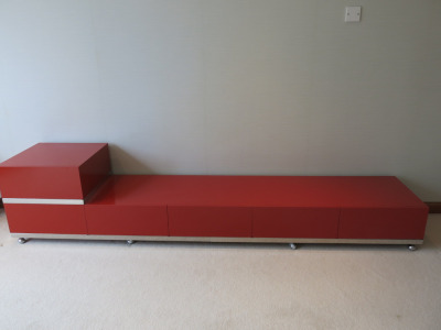 6 Draw Gloss Red Wooden Side Unit with Mirrored Trim Castors. Size H52 x W250 x D50cm.