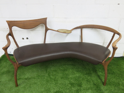 Cecotti Collezioni D.R.D.P (Double Dream of Spring) by Designer Roberto Lazzeroni, 2 Seater Bench Seat in Walnut with Leather Seat & Brass Centre Rest. NOTE: requires repair to back right frame as pictured.