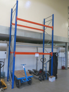 4 x Bays of Factory Orange & Blue Boltless Pallet Racking To Include: 8 x Uprights, Size Approx 4M-5M & 16 x Assorted Sized Beams. NOTE: removal of the racking will be at the end of the clearance period by appointment.