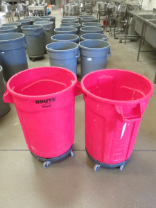 2 x Rubbermaid Brute 32 Gallon Plastic Bins on Castors, In Red.