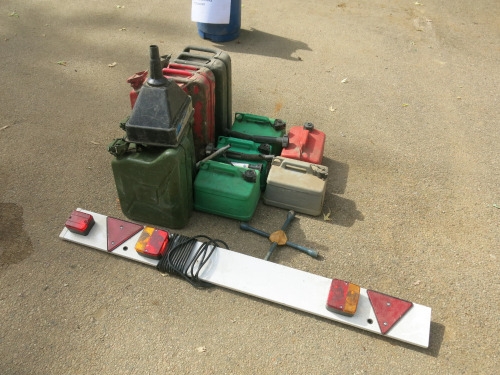 4 x Jerry Cans, 2 x 20L, 2 x 10L with 5 x 5 Litre Plastic Petrol Cans, Funnel and Light Board.