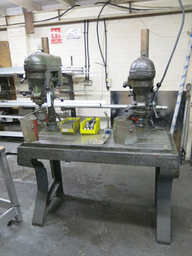 2 x Elliot Progress 2G Pillar Drills, 3 Phase, Mounted on Heavy Duty Metal Working Bench with Assorted Chucks & Accessories (As Viewed).
