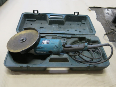 Makita 9" Electric Angle Grinder, Model GA9020. Comes in Carry Case.