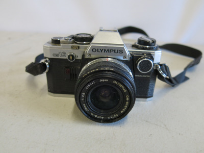 Vintage Olympus OMID 35mm SLR Film Camera with 28mm 1.2.8 Lens, S/N 384378.