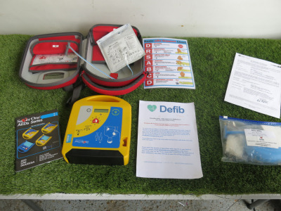 Saver One Portable Defibrillator in Case with Attachments. S/N 17SA005042200079, Year 04/2022.