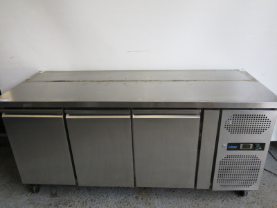 Adexia 3 Door Undercounter Mobile Stainless Steel Preparation Fridge. Model GN3100TN. Size H84 x W179 x D70cm.