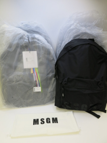 7 x MSGM Black Backpacks with Dustcovers. RRP £180.00 each.